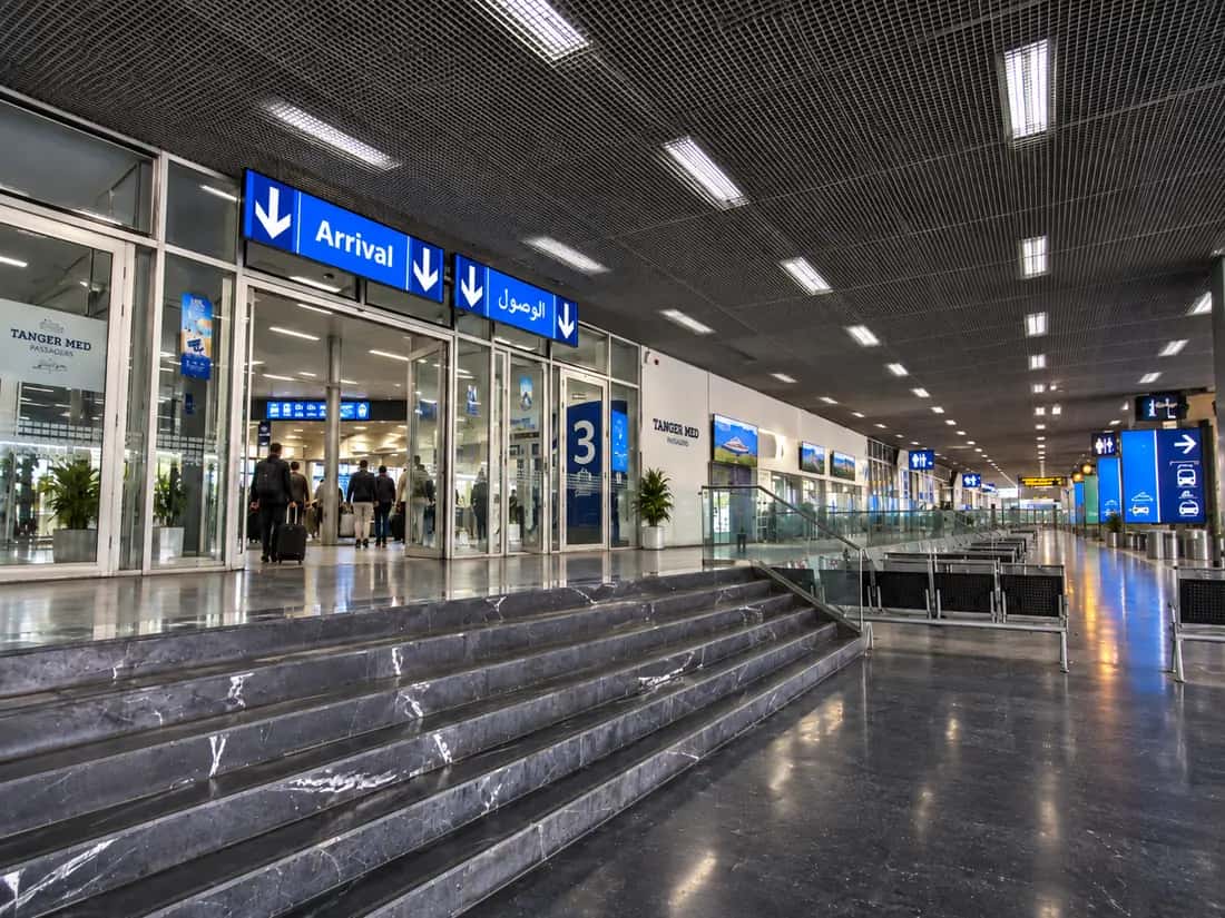 Passenger arrivals hall at Tanger Med Port with terminal signs