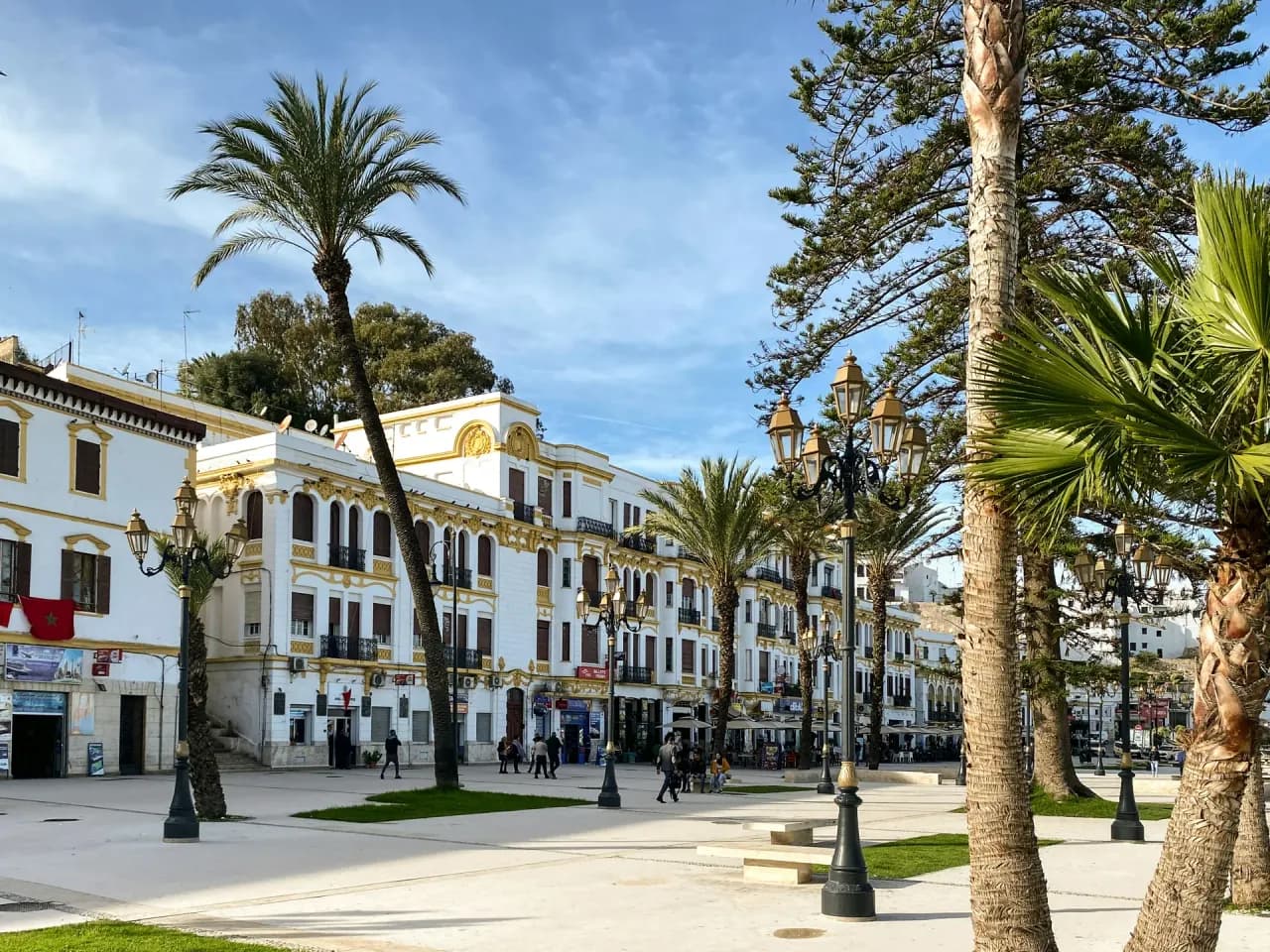 A palm-lined square and white buildings in central Tangier, Morocco